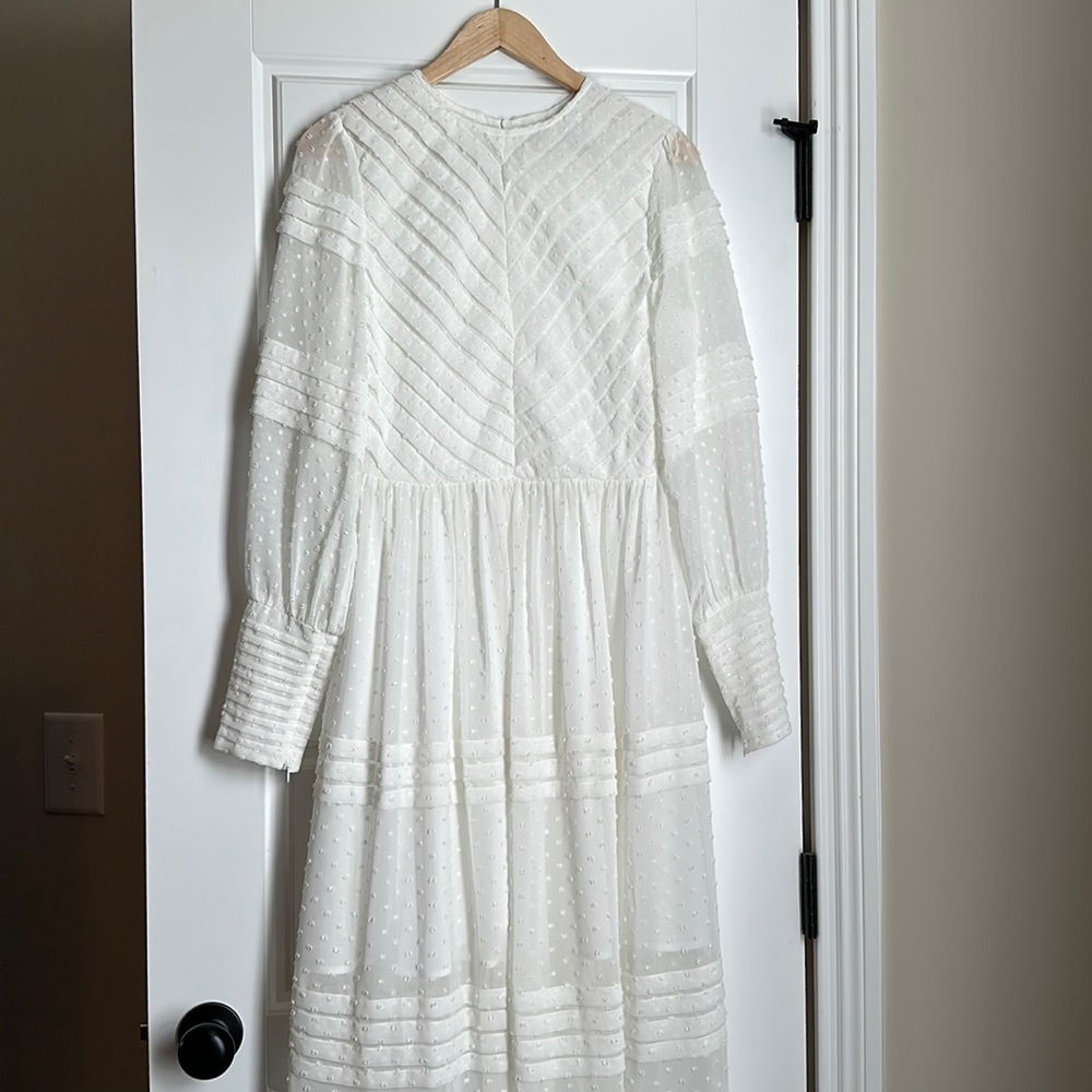 White midi dress. New but without tags. Originally purchased from Shopbop